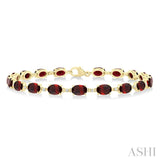 6X4 MM Oval Cut Garnet and 1/6 Ctw Round Cut Diamond Semi-Precious Tennis Bracelet in 10K Yellow Gold